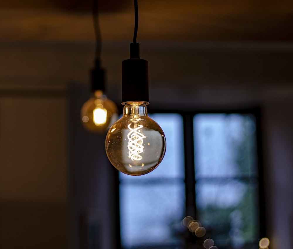 a light bulb hanging from a ceiling in a room