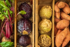 a couple of boxes filled with different types of vegetables