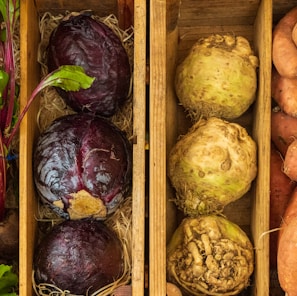 a couple of boxes filled with different types of vegetables