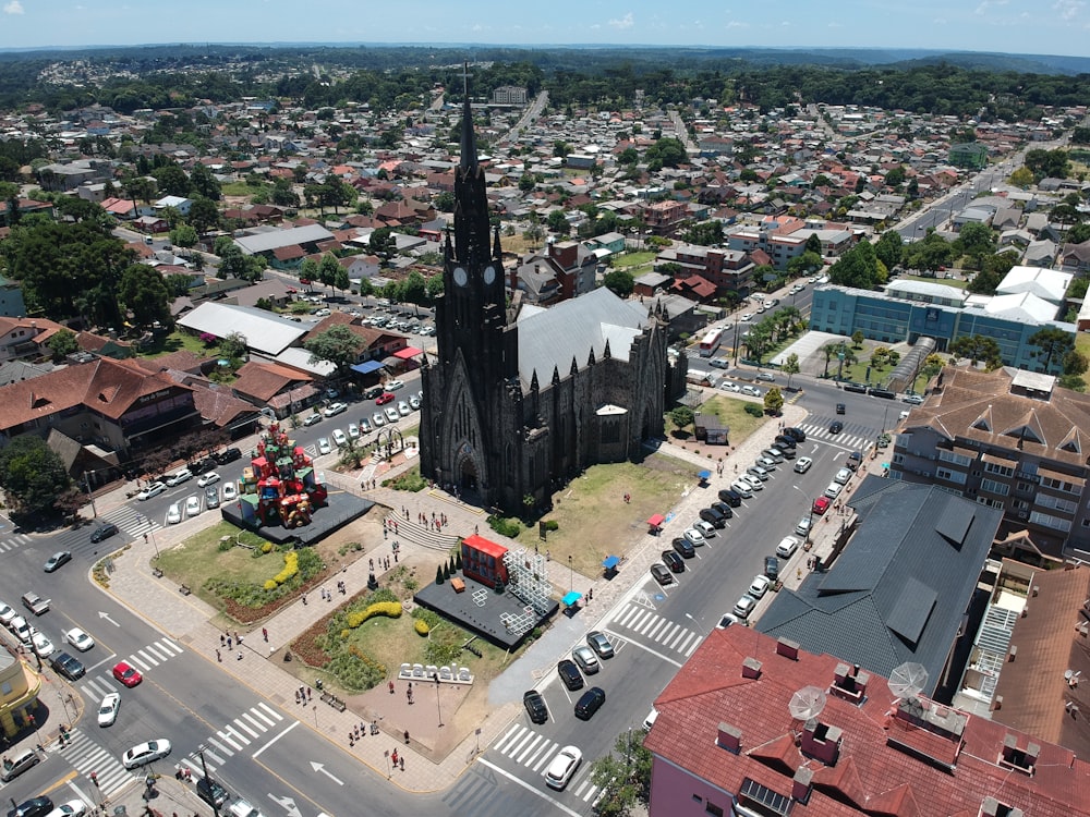 an aerial view of a city with a large cathedral