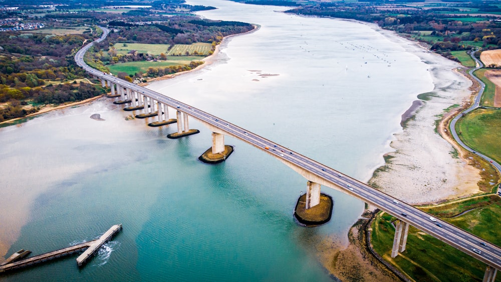 an aerial view of a bridge over a body of water