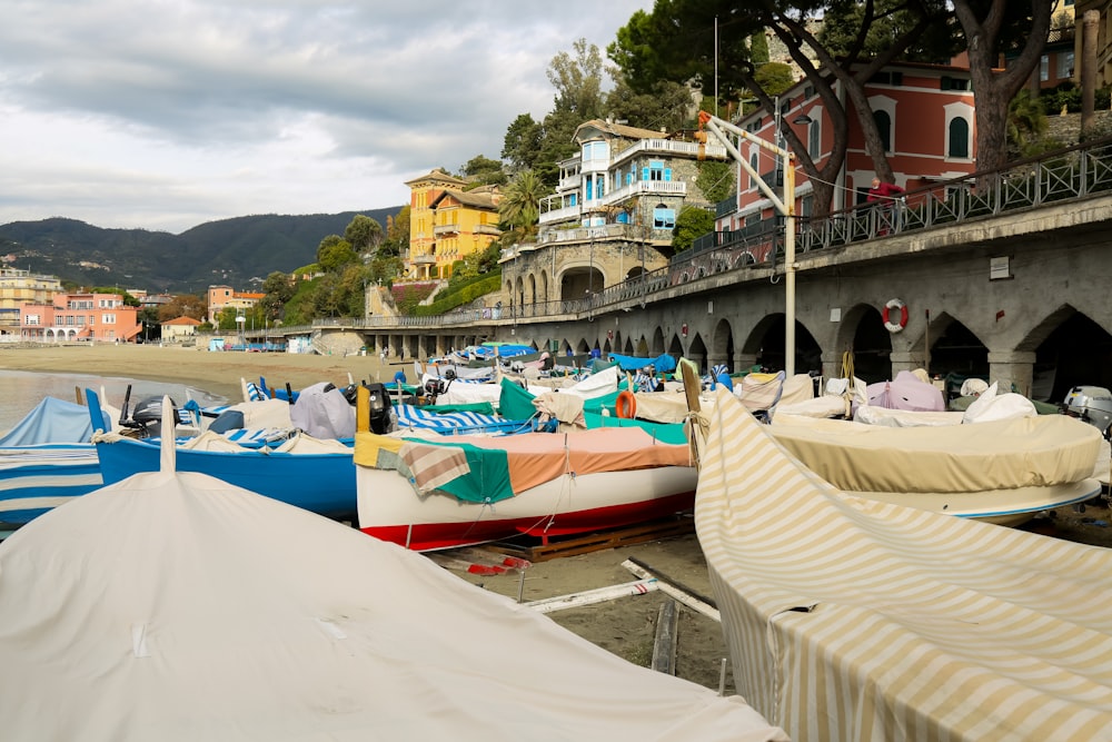 a bunch of boats that are sitting in the sand