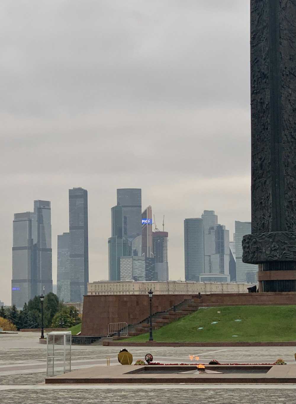 a large monument with a city in the background