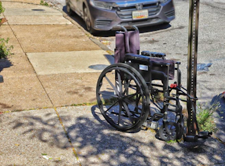 a wheelchair parked on the side of the road