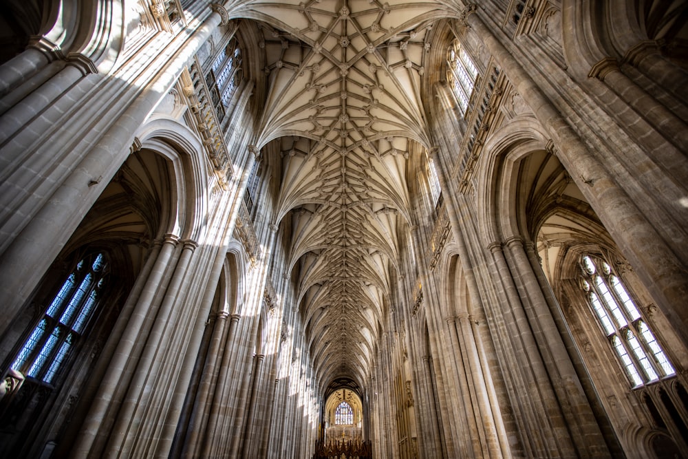 the ceiling of a large cathedral with many windows