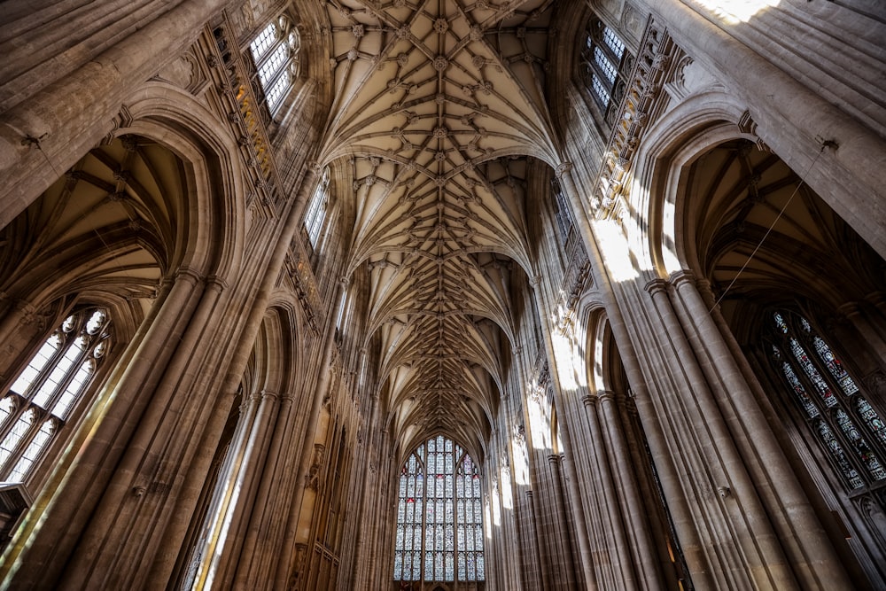 the ceiling of a large cathedral with many windows