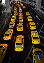 a street filled with lots of yellow taxi cabs