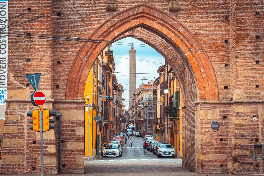 a street with cars parked on both sides of it,