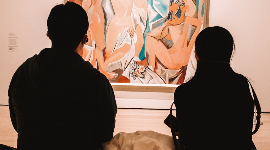 two people looking at a painting in a museum