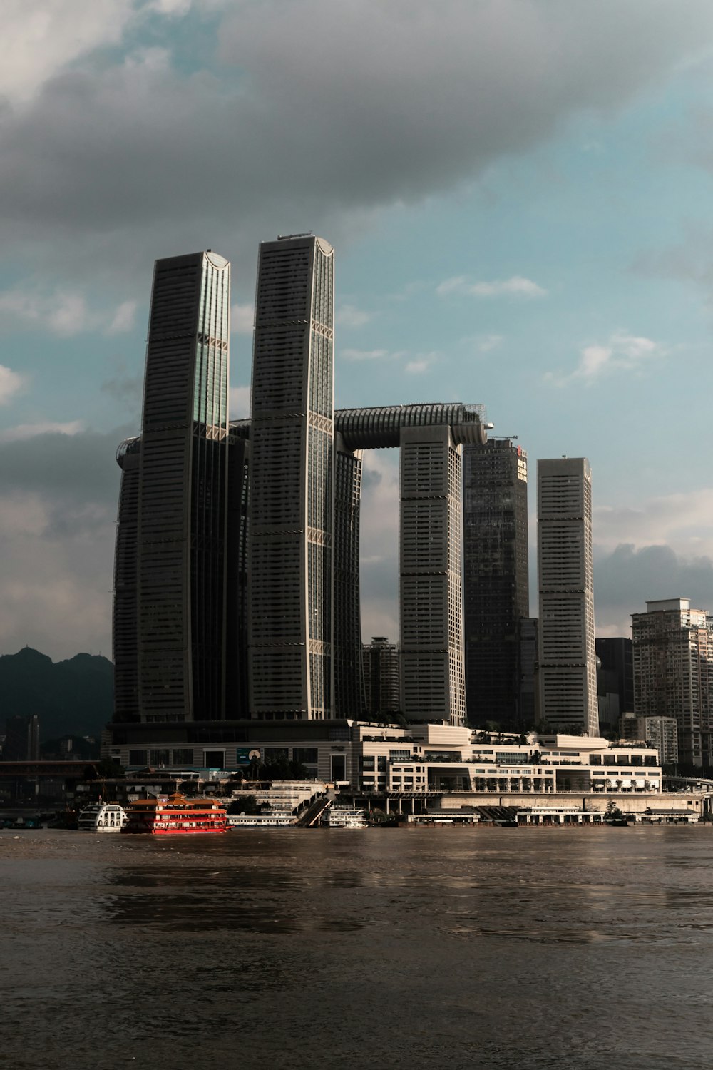 a large body of water with a bunch of tall buildings in the background