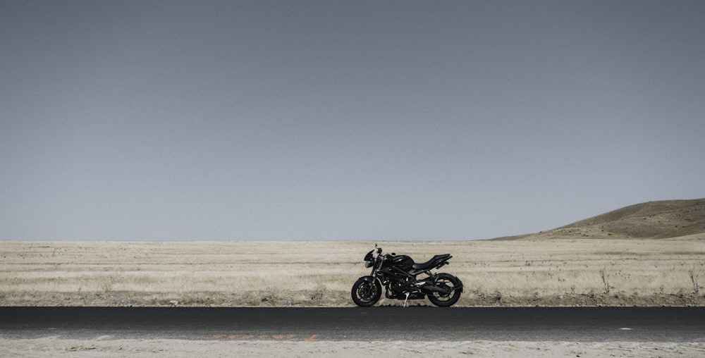 a motorcycle parked on the side of the road