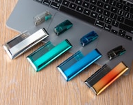 a laptop computer with a bunch of batteries on it