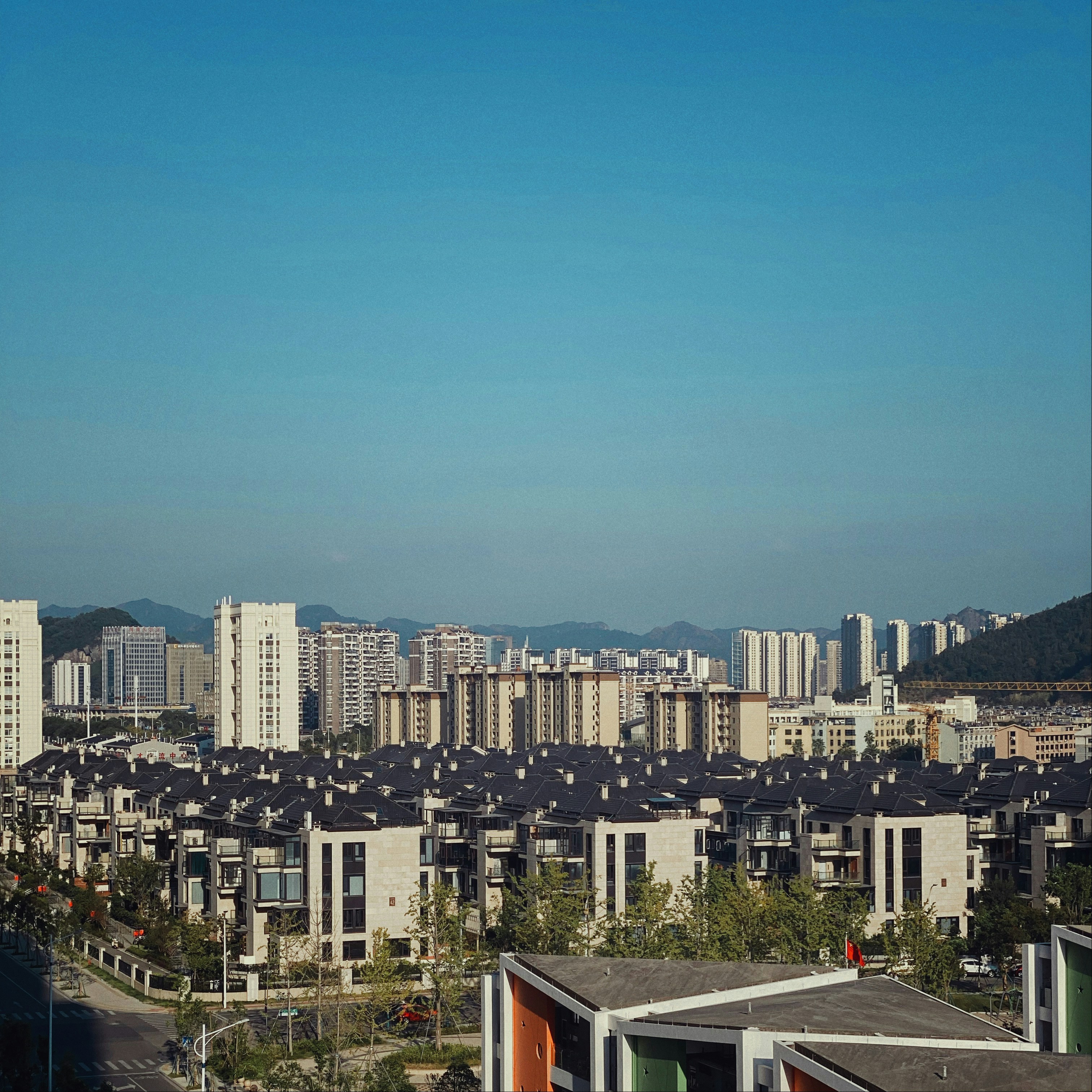 a view of a city with tall buildings