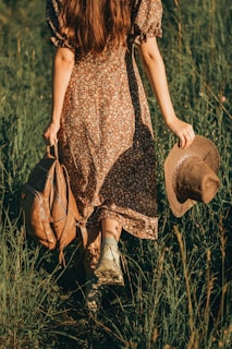a person that is standing in the grass