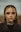 a woman with long hair and piercings on her head