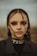 a woman with long hair and piercings on her head
