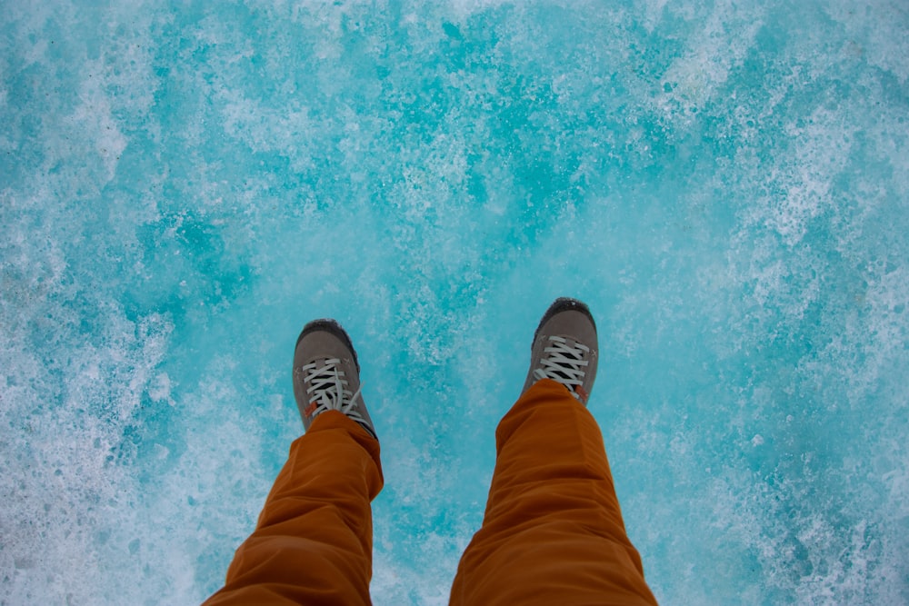 a person standing in front of a body of water