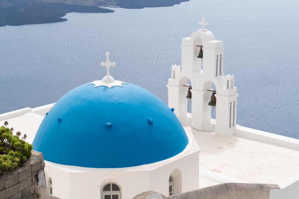 a white and blue church with a blue dome