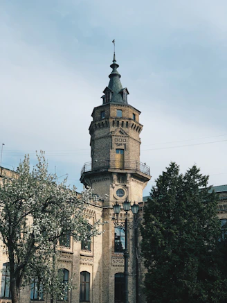 a tall tower with a clock on the top of it