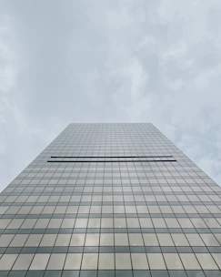 a very tall building with a sky background