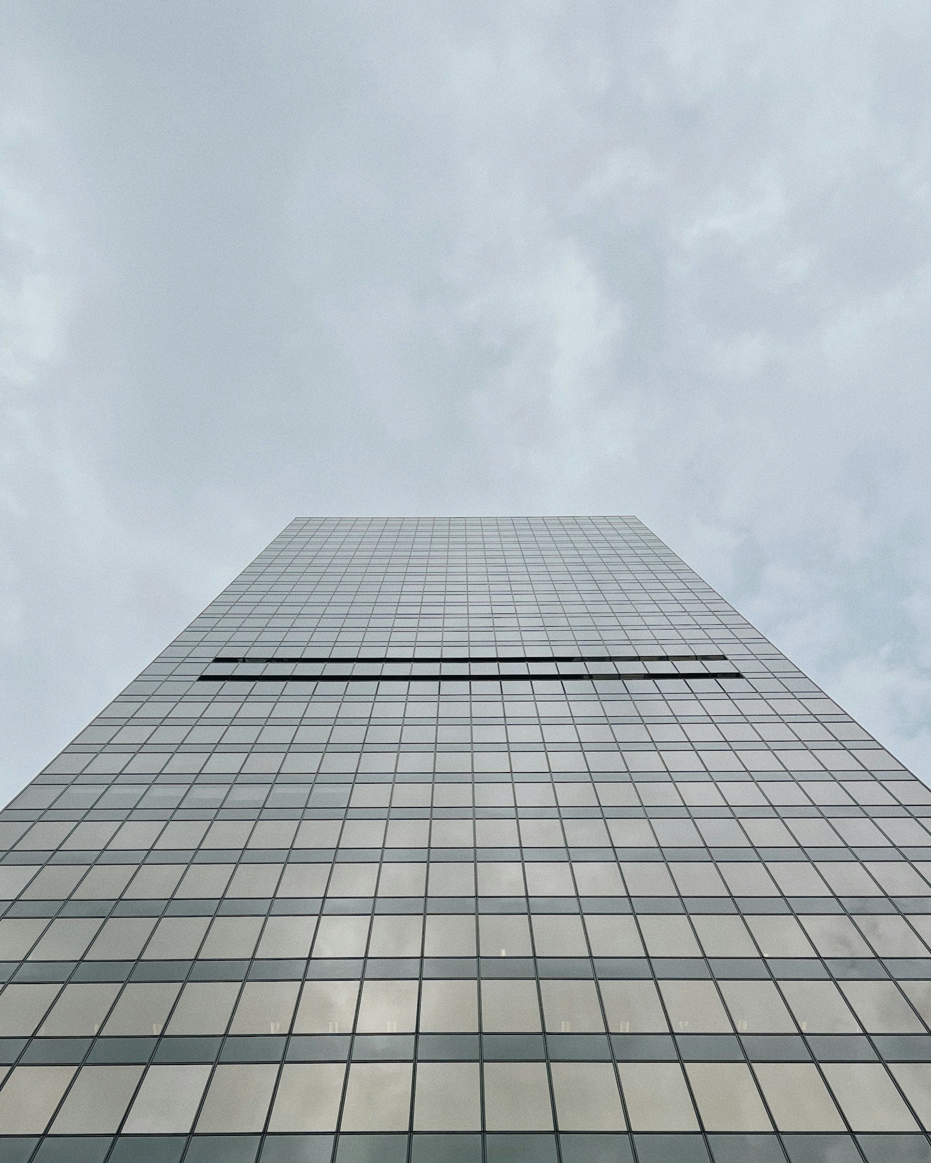 a very tall building with a sky background