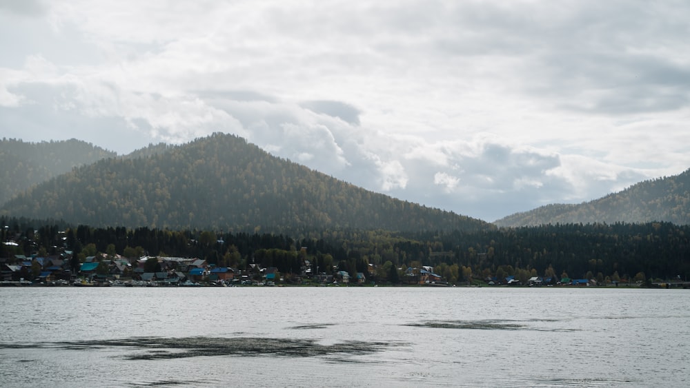 a body of water with a mountain in the background