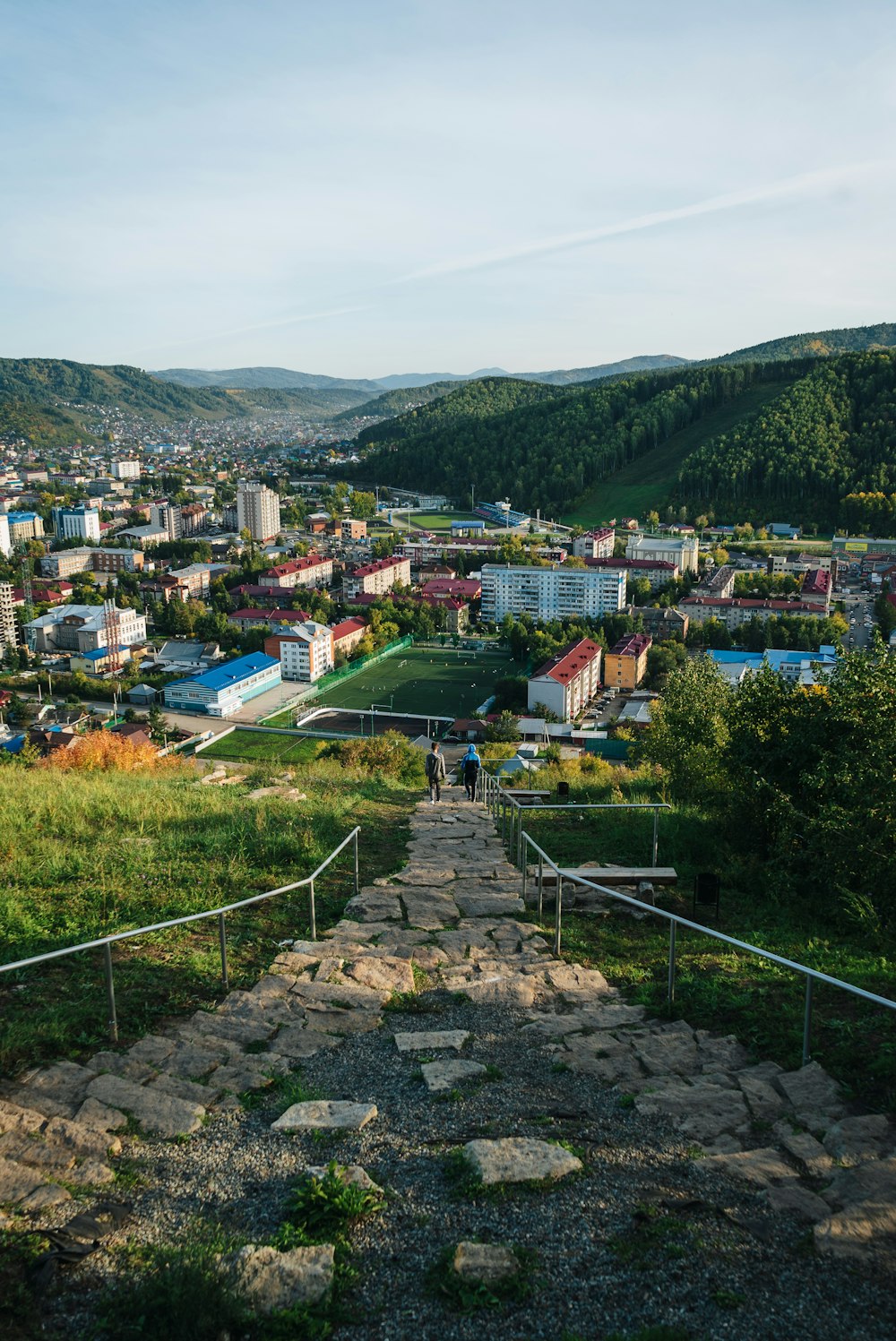 a view of a city from the top of a hill