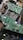 Several green circuit boards with various electronic components such as resistors, capacitors, and integrated circuits. Ribbon cables connect the boards, and blue cables are visible in the background.