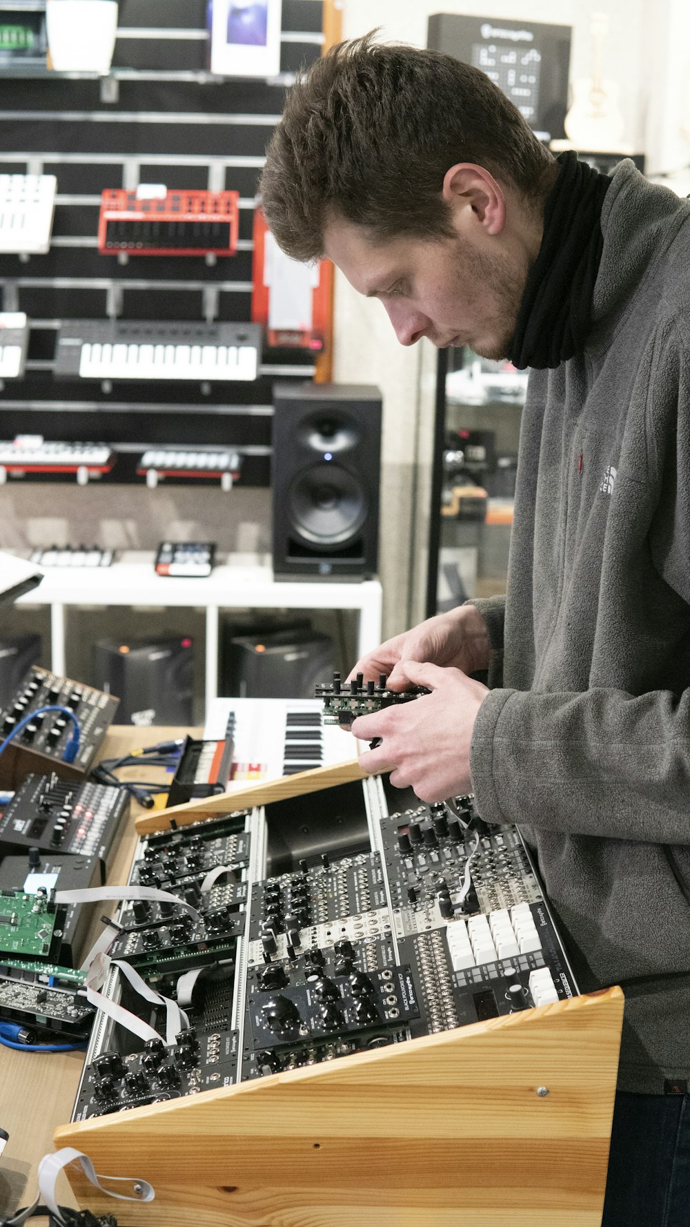 a man is working on an electronic device