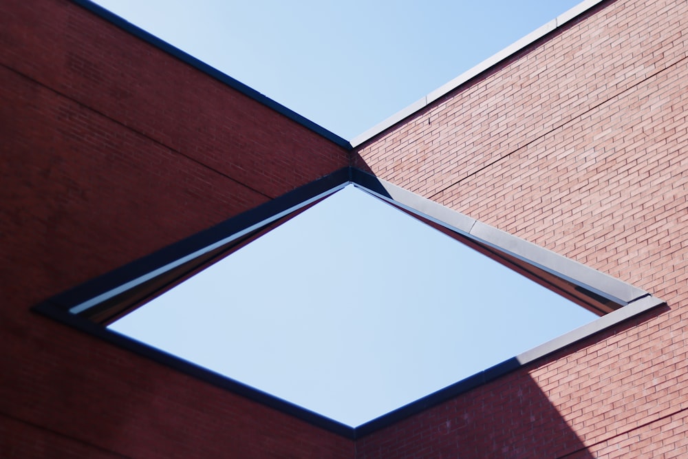 a brick building with a skylight in the middle of it