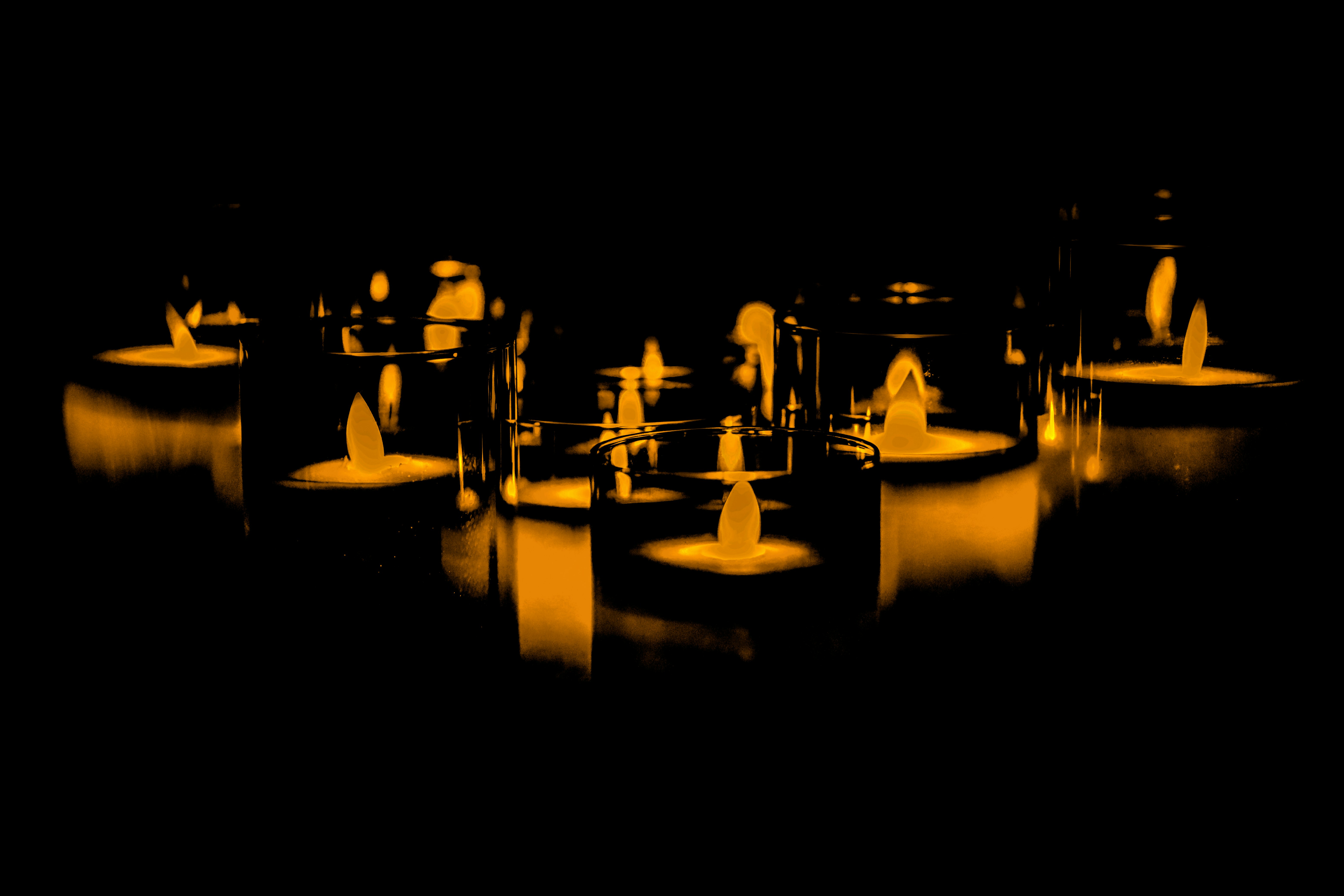 a group of candles sitting on top of a table