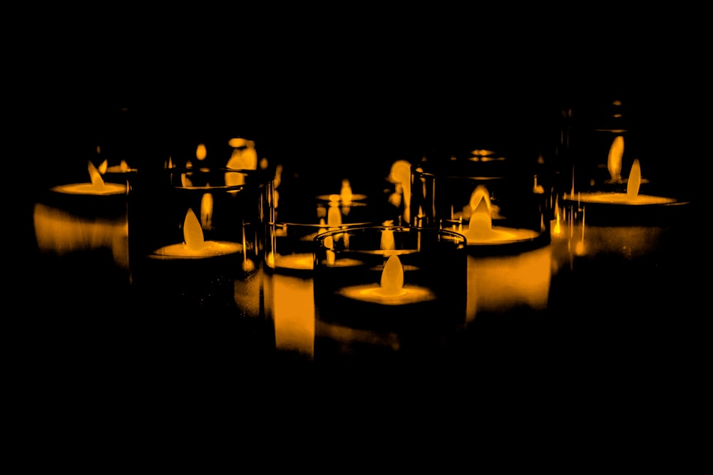 a group of candles sitting on top of a table