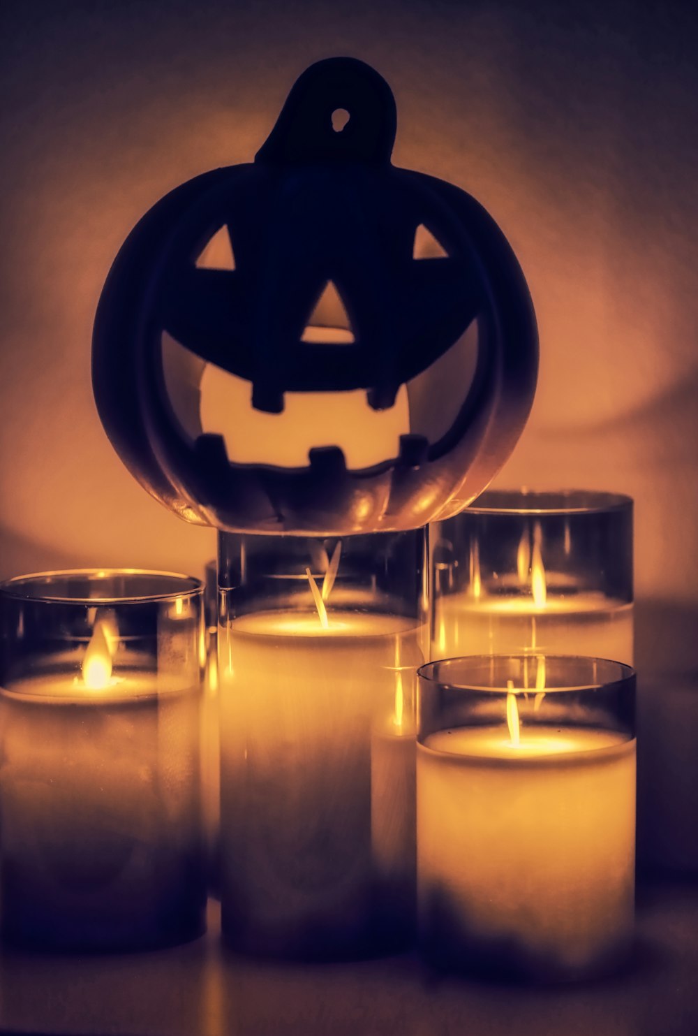 a group of lit candles sitting on top of a table