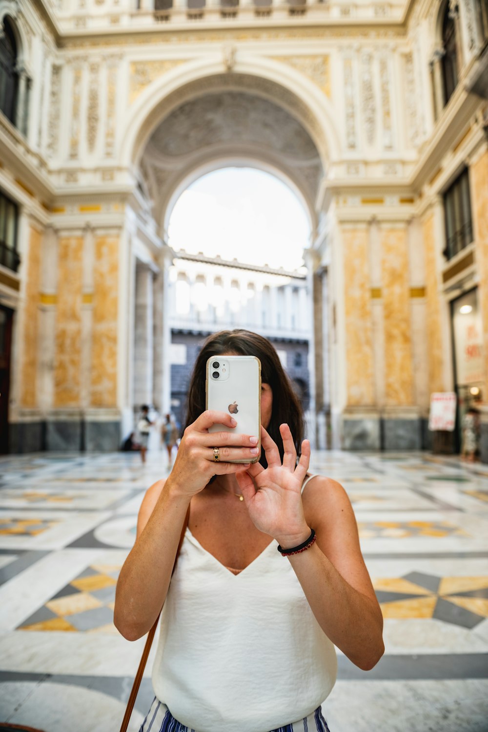 a woman taking a picture with her cell phone