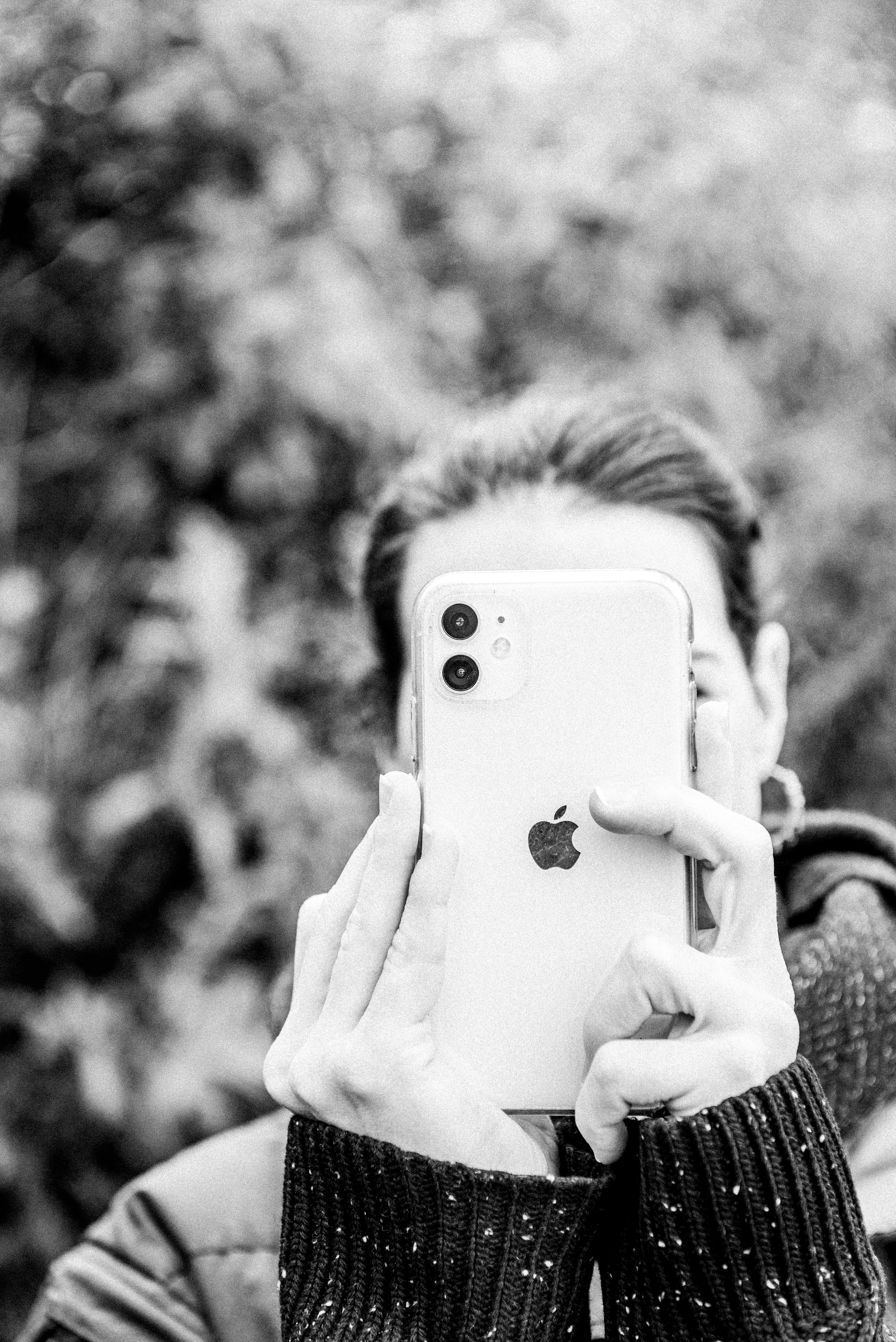 a man taking a selfie with his iphone