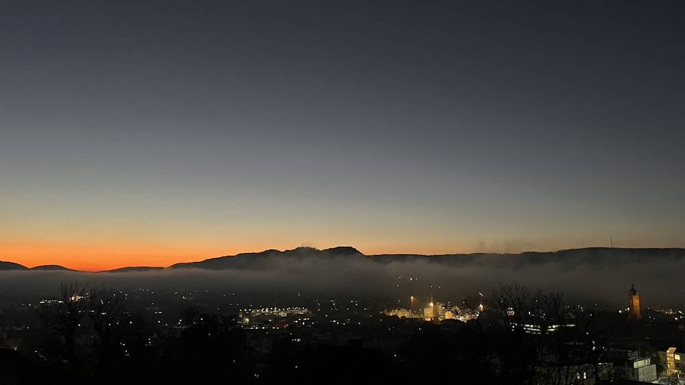 a view of a city with mountains in the background