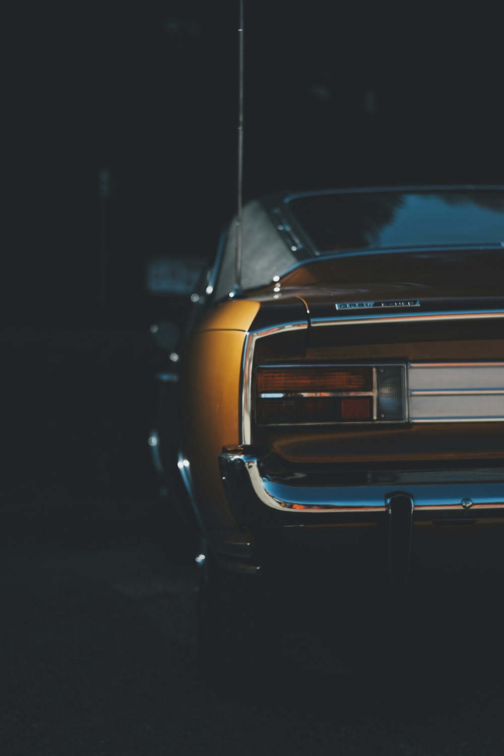 a car parked in a dark parking lot