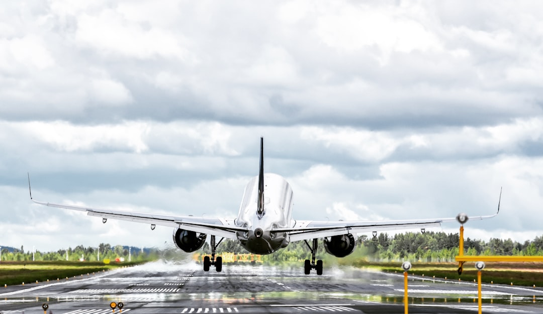 a large jetliner taking off from an airport runway,