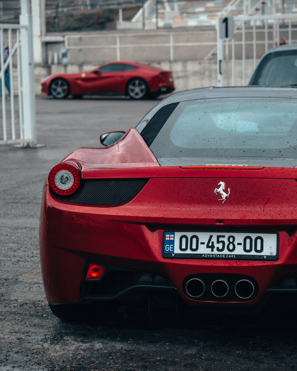 a red sports car parked in a parking lot