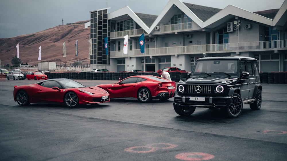 a couple of cars parked next to each other in a parking lot