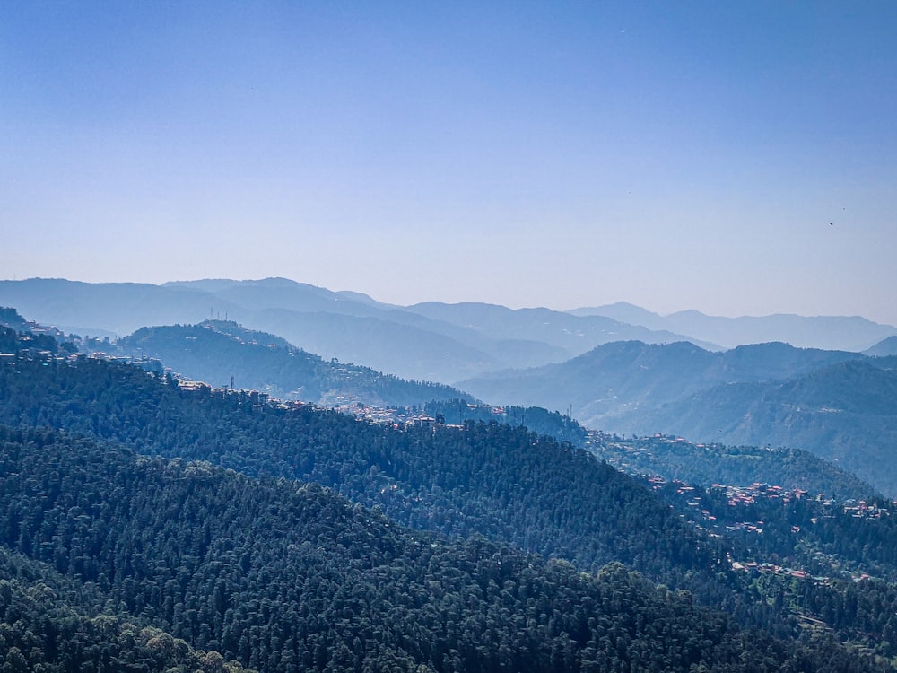 a view of a mountain range with a town in the distance