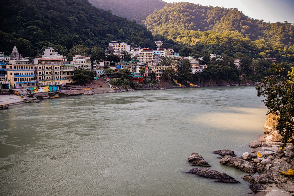 a river running through a lush green hillside