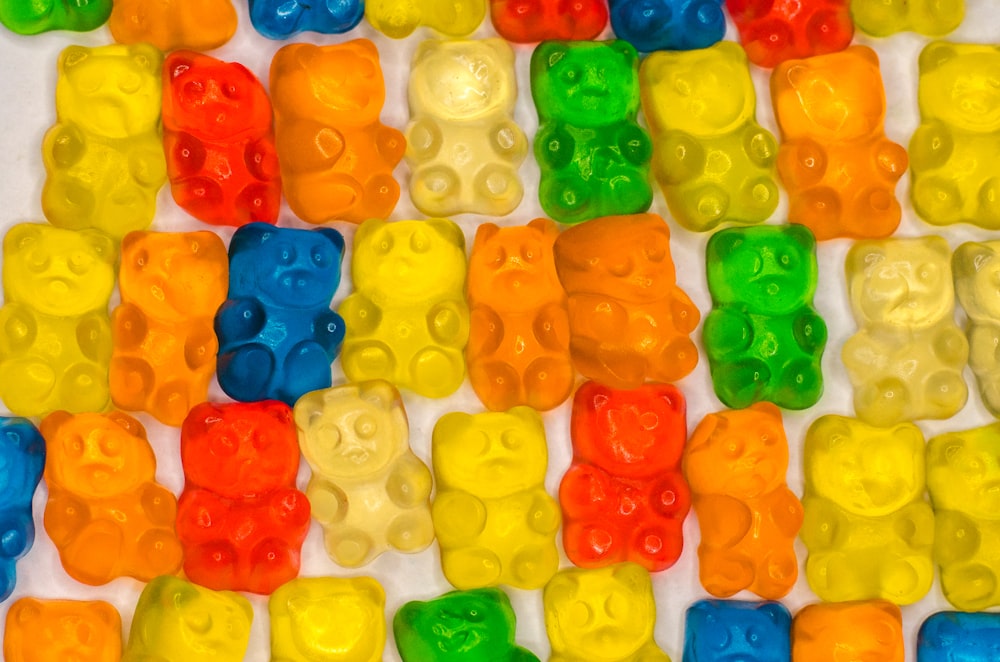 a group of gummy bears sitting on top of a table