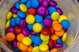 Close-up of colorful candies swirling in motion.