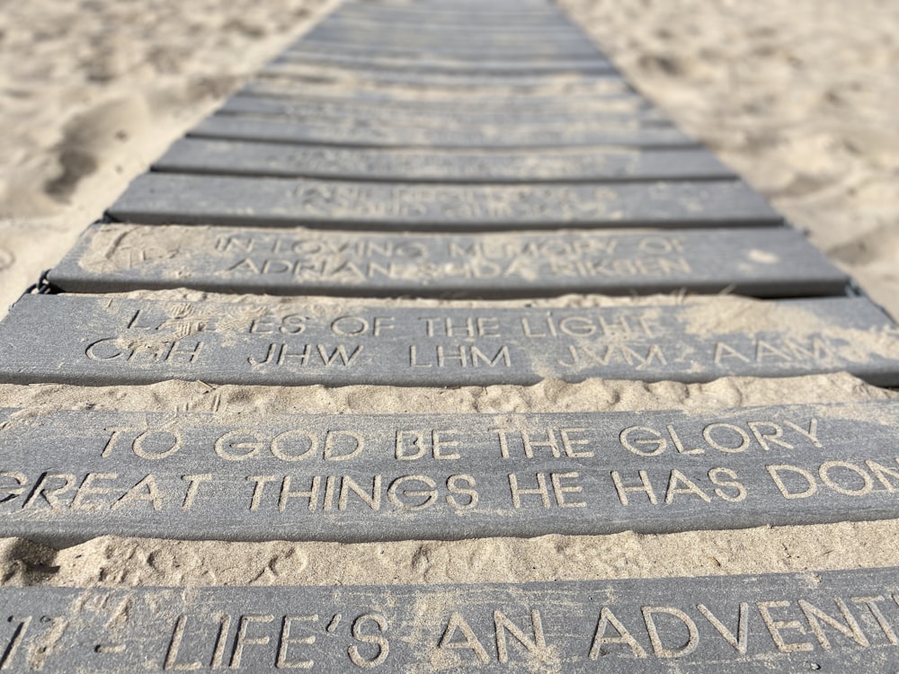 a long row of sand with writing on it