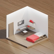a small room with a bed and a desk