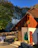 A quaint café terrace in Kotor with people enjoying coffee and pastries.
