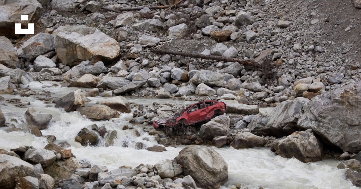 A red raft is in the middle of a river photo – Free Адыл-су Image on ...