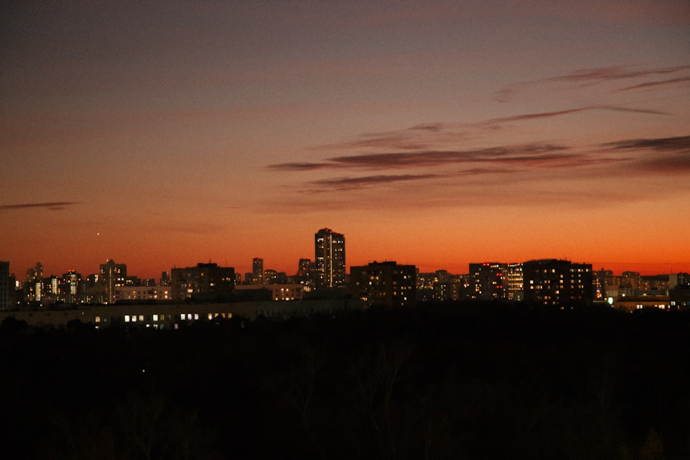 a view of a city at night from a hill