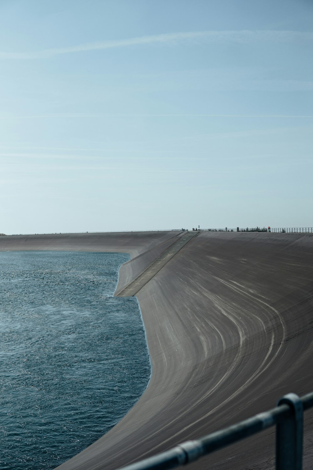 a body of water next to a sandy beach